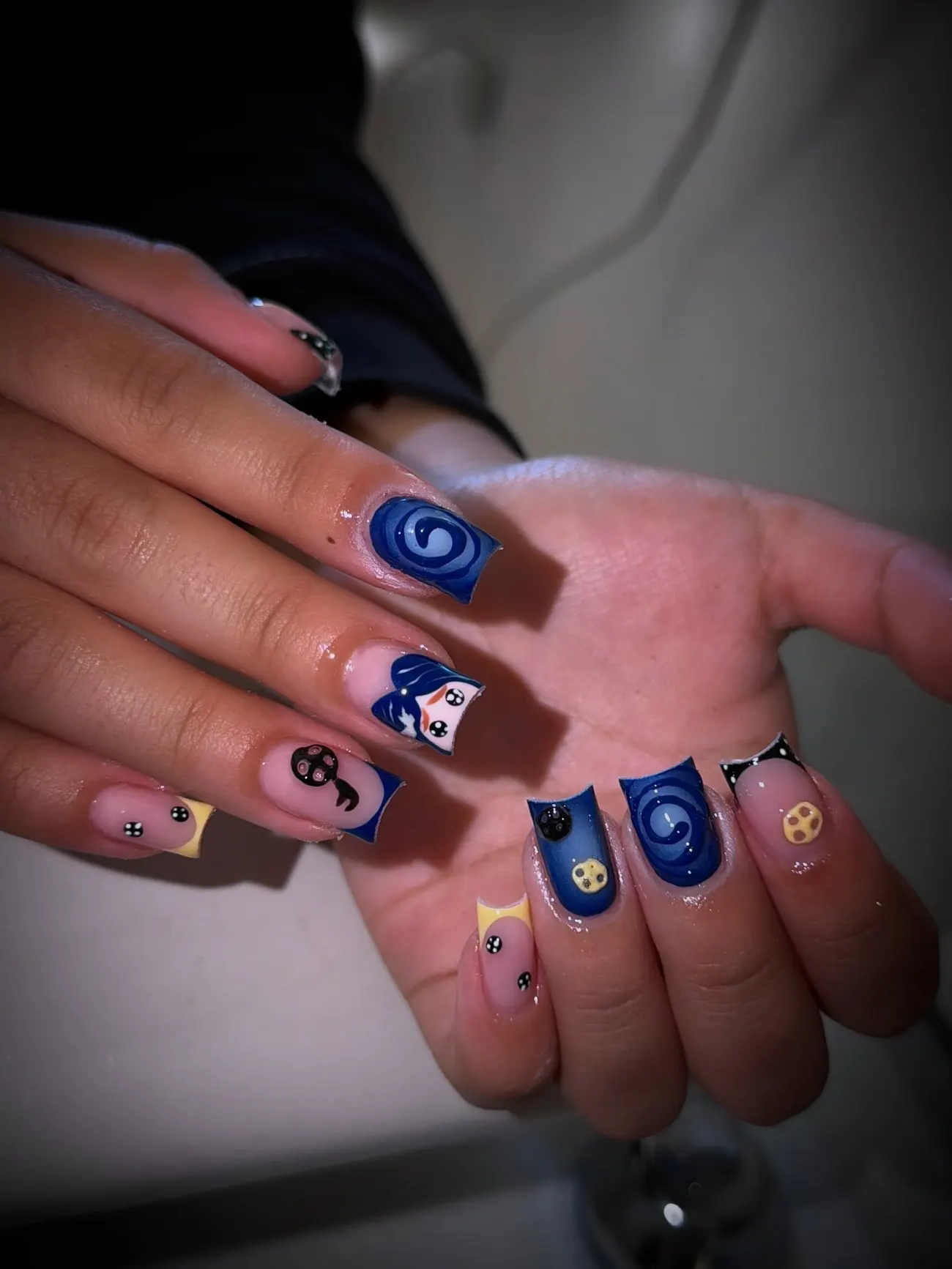 Coraline-inspired hand-painted nail set in deep blue